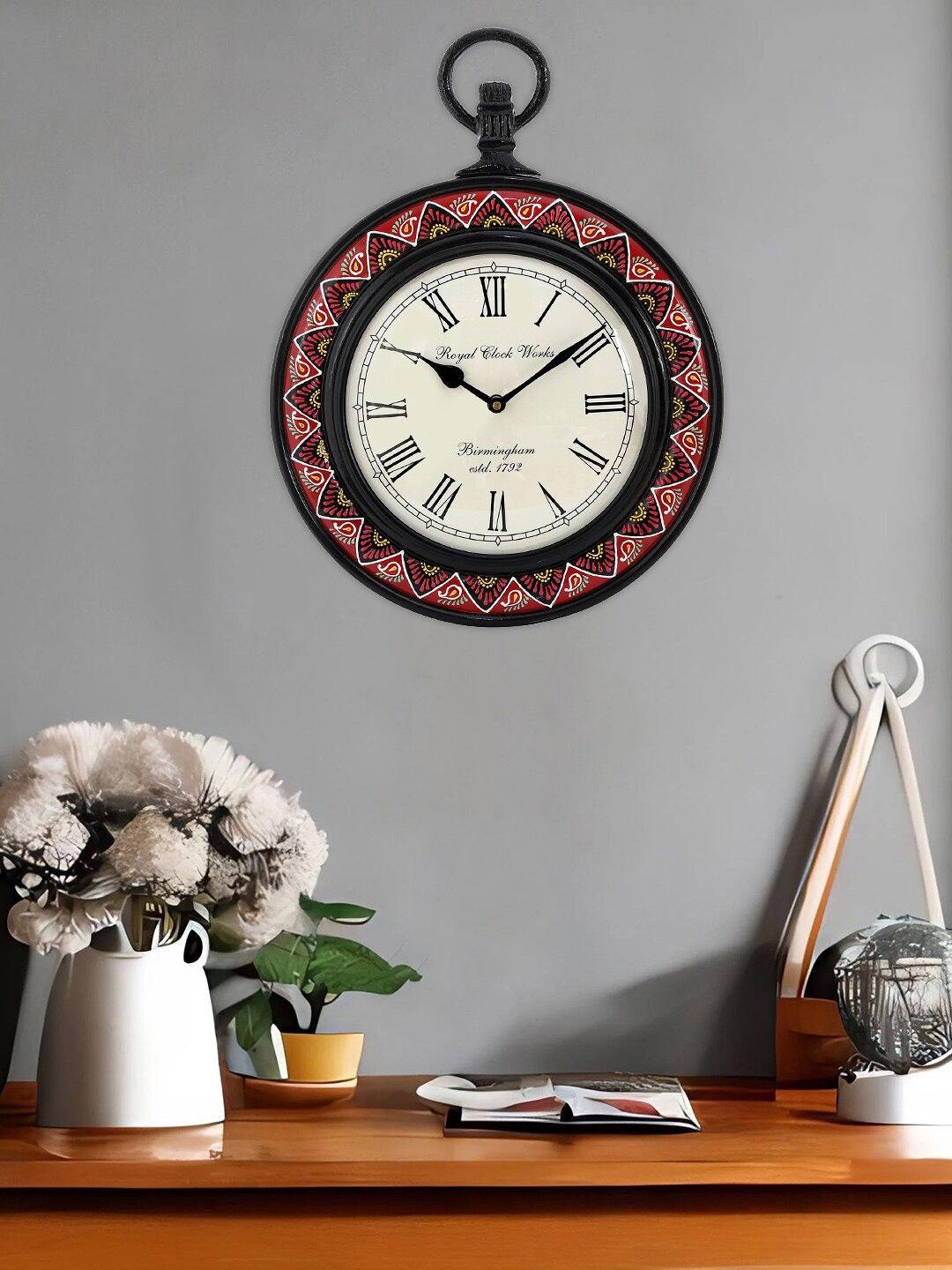 

Aapno Rajasthan White & Red Printed Analogue Contemporary Wall Clock