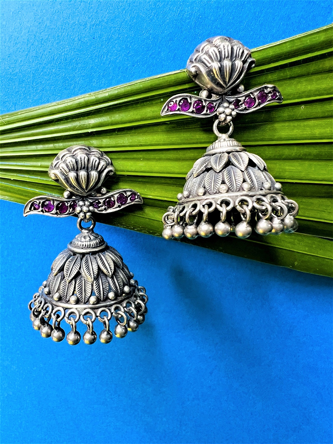 

Arte Jewels Silver-Toned Stone Studded Contemporary Jhumkas