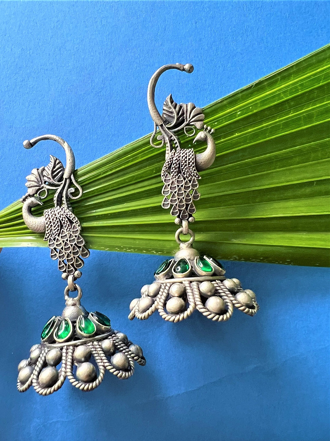 

Arte Jewels Studded Peacock Shaped Sterling Silver Jhumkas