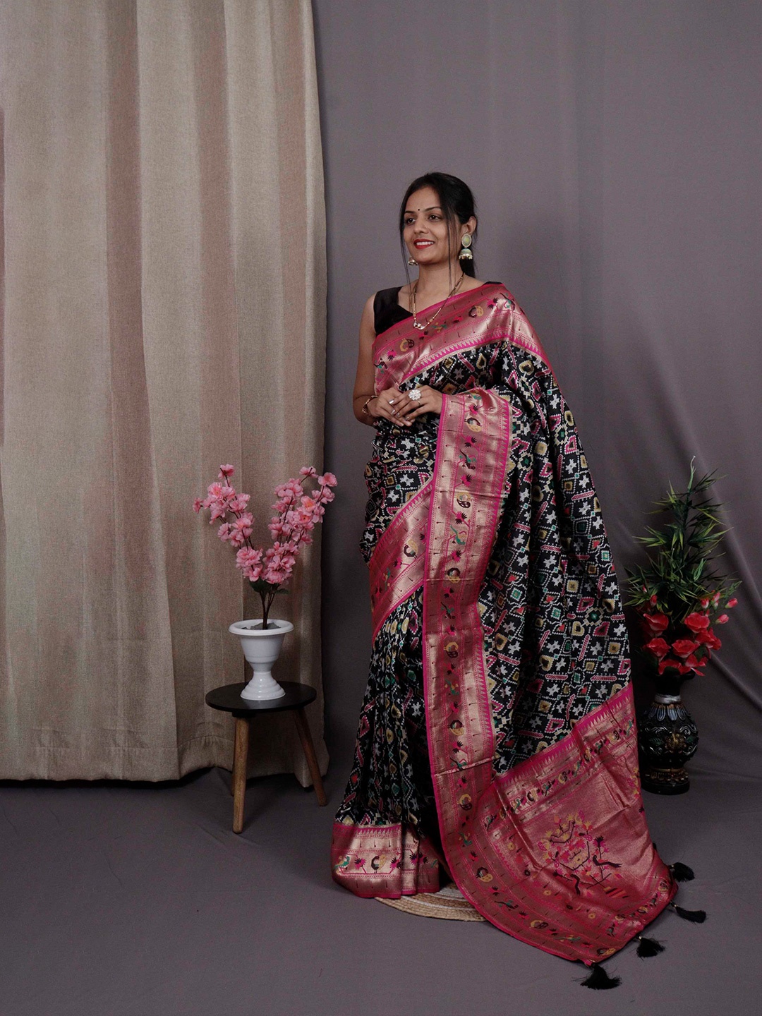 

Mitera Black & Pink Ethnic Motifs Woven Design Zari Patola Saree