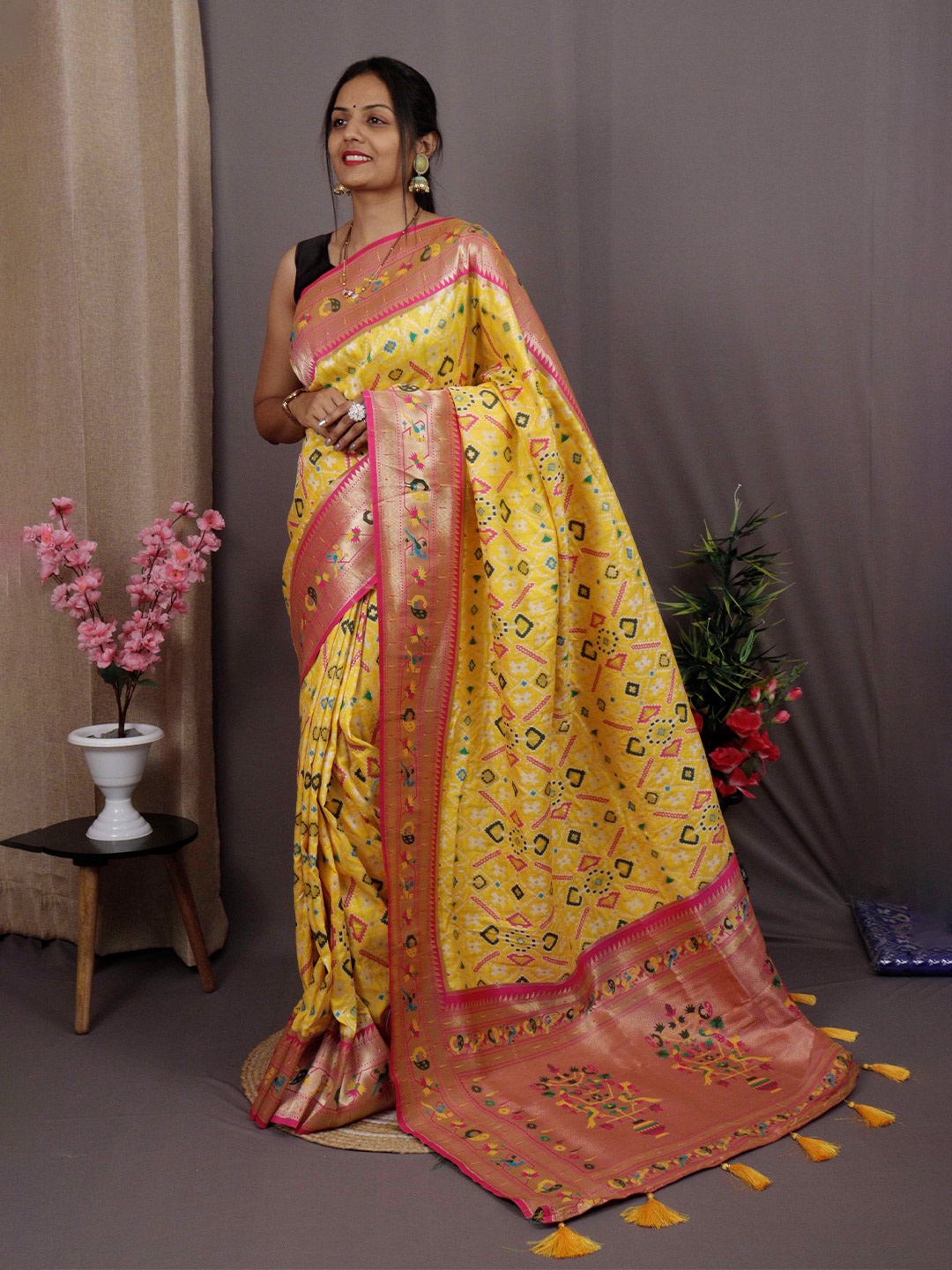 

Mitera Yellow & Pink Ethnic Motifs Woven Design Zari Patola Saree