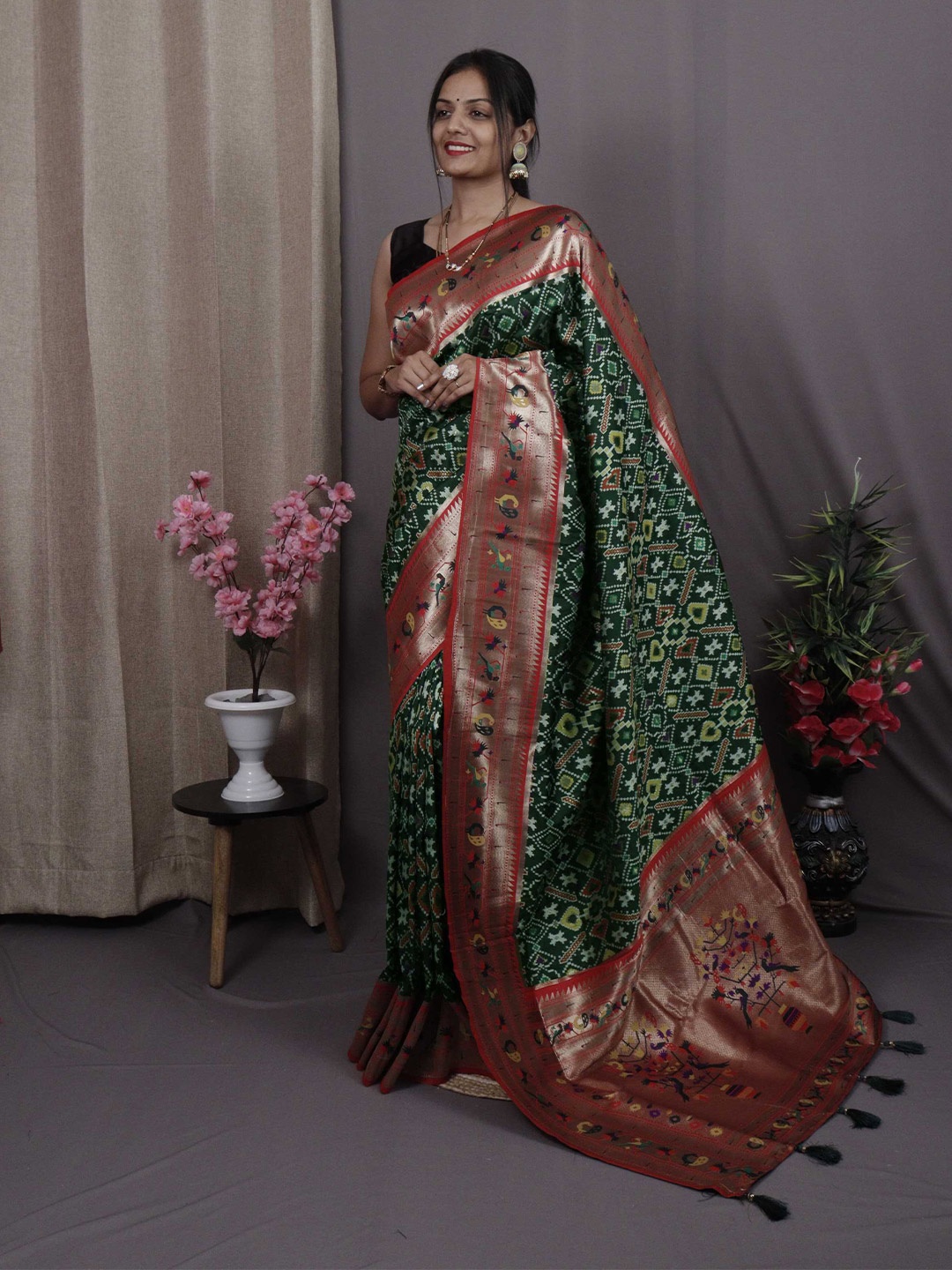 

Mitera Green & Red Ethnic Motifs Woven Design Zari Patola Saree