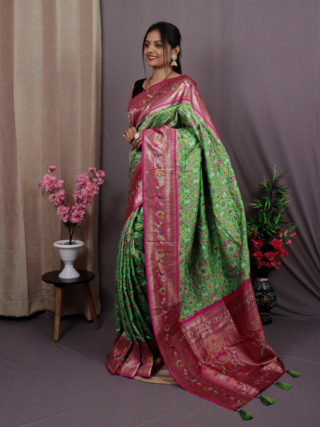 

Mitera Green & Pink Woven Design Zari Patola Saree