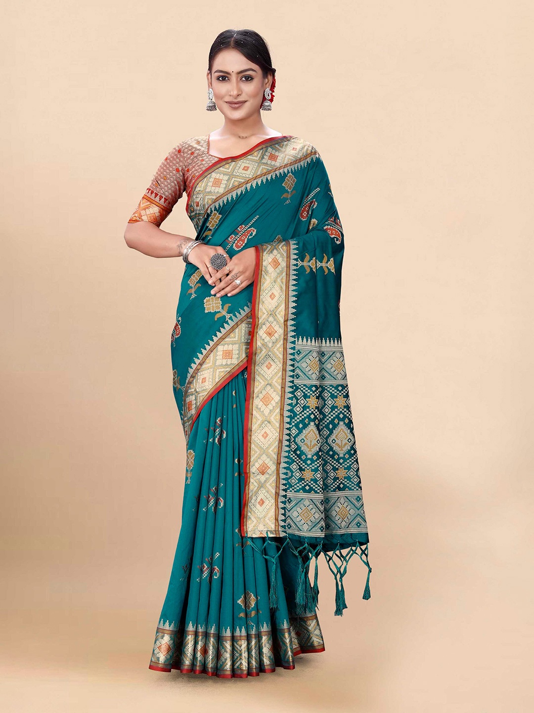 

Mitera Teal & Red Ethnic Motifs Woven Design Zari Patola Saree