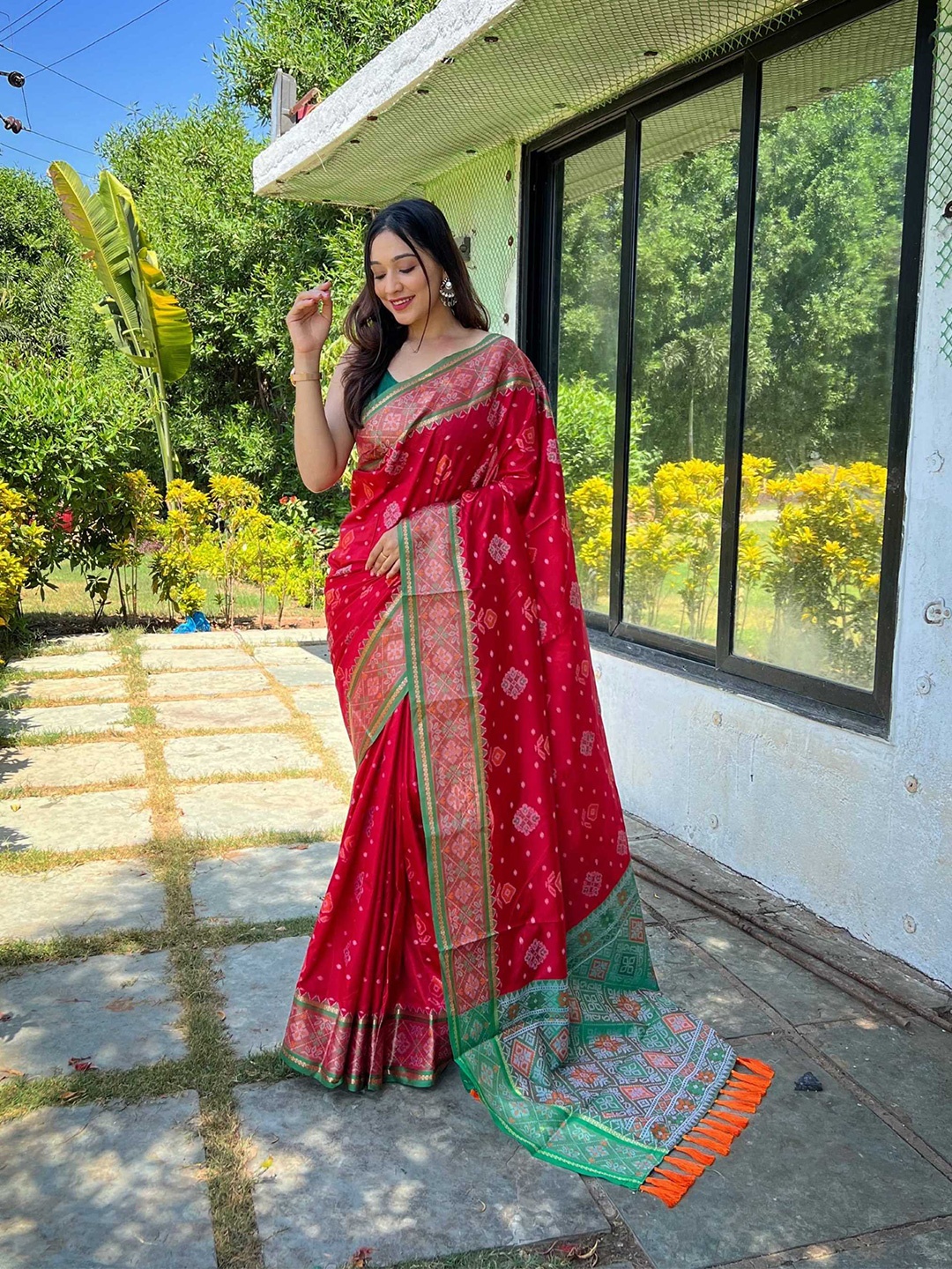

Mitera Red & Green Woven Design Zari Patola Saree