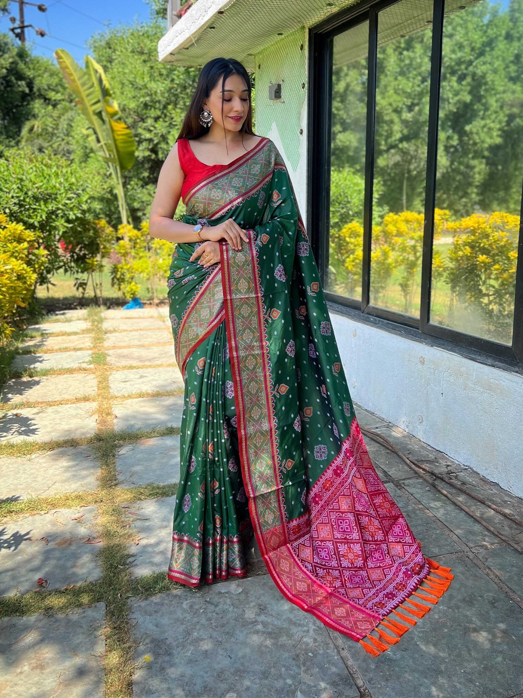 

Mitera Green & Pink Woven Design Ethnic Motifs Zari Silk Blend Patola Saree