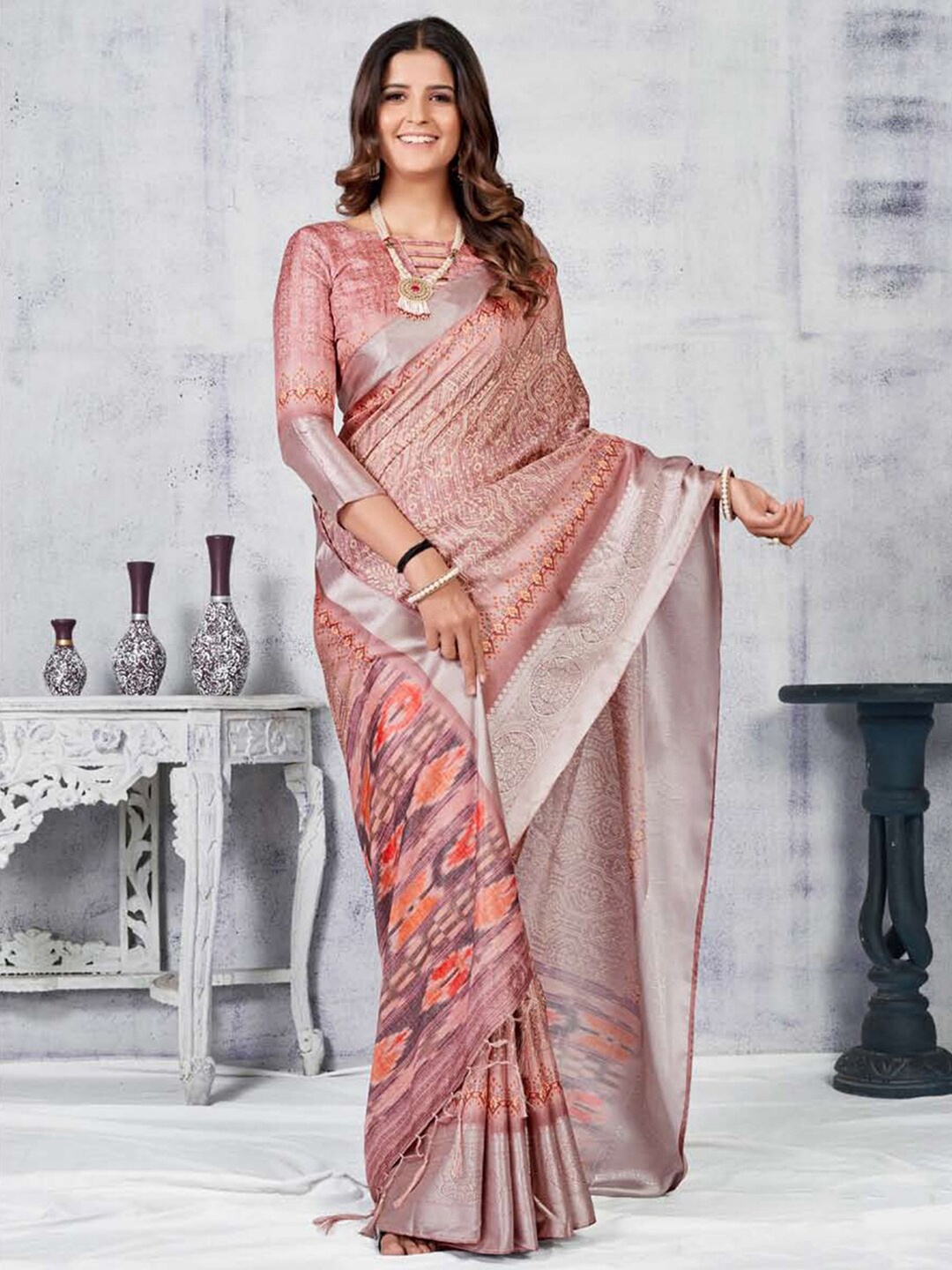 

Mitera Pink & Orange Ethnic Motifs Zari Silk Blend Saree