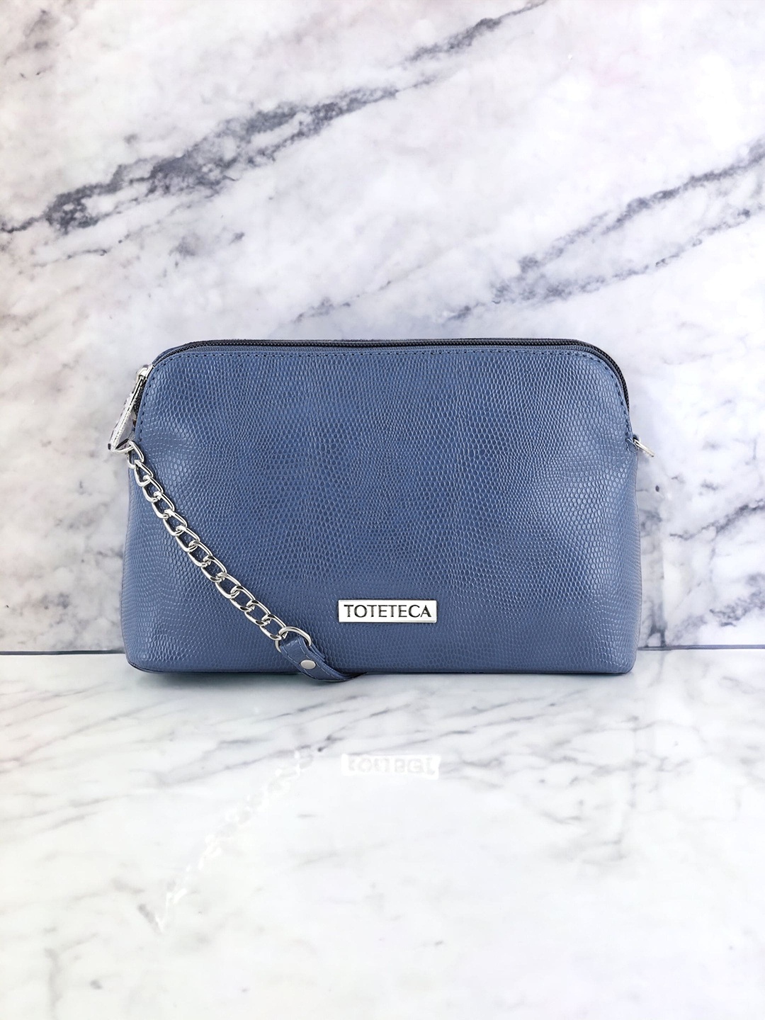 

Toteteca PU Textured Structured Sling Bag, Blue