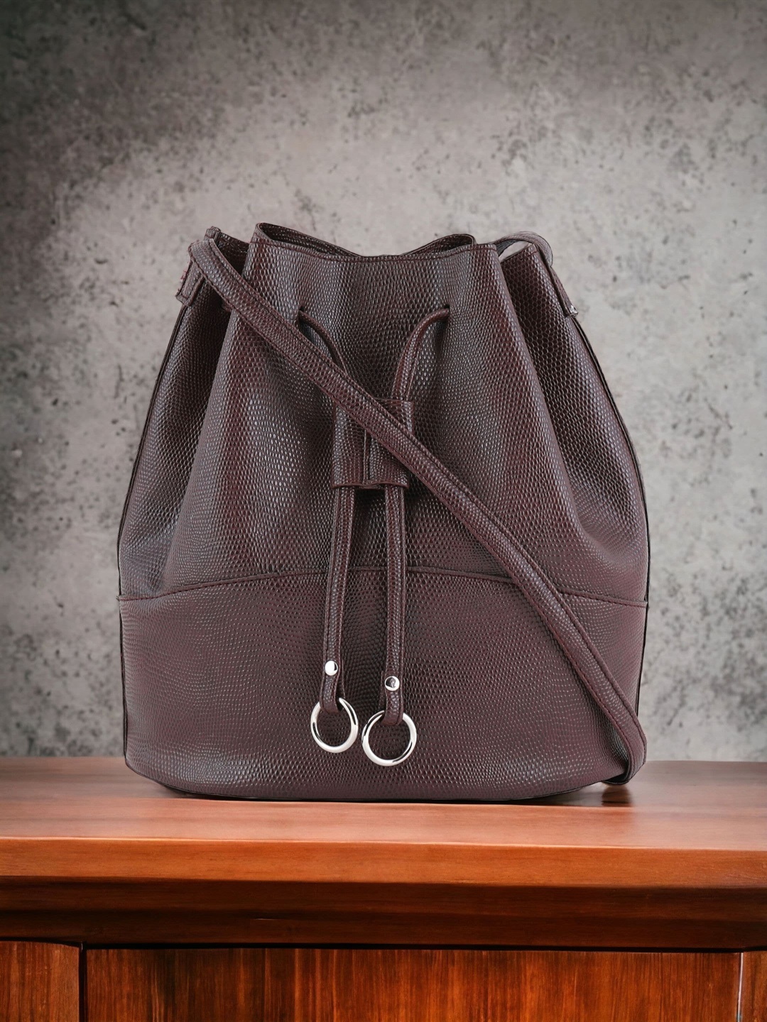 

Toteteca Textured Bucket Sling Bag, Brown