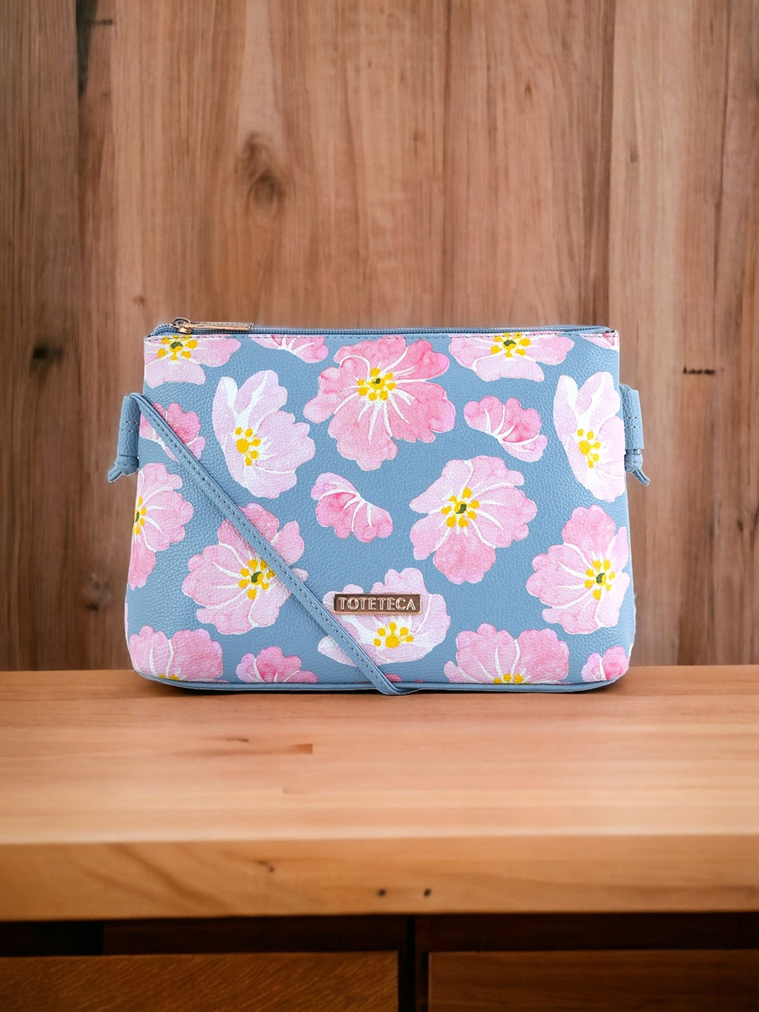

Toteteca Blue Floral Printed PU Structured Sling Bag