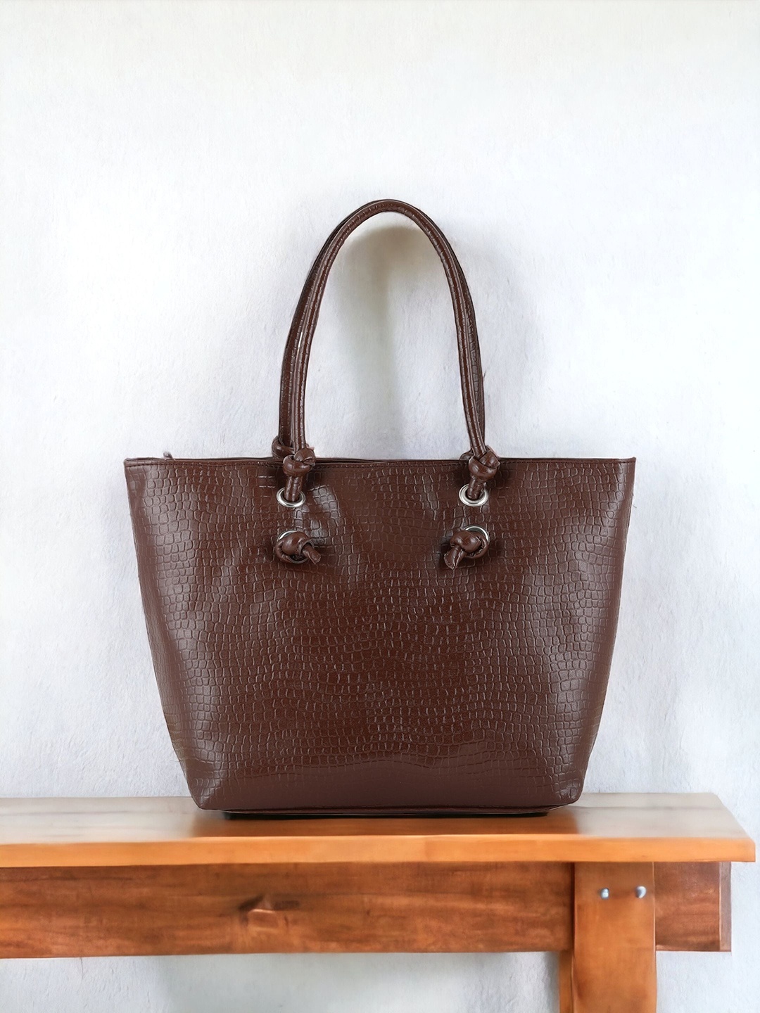 

Toteteca Structured Handheld Bag With Cut Work, Brown