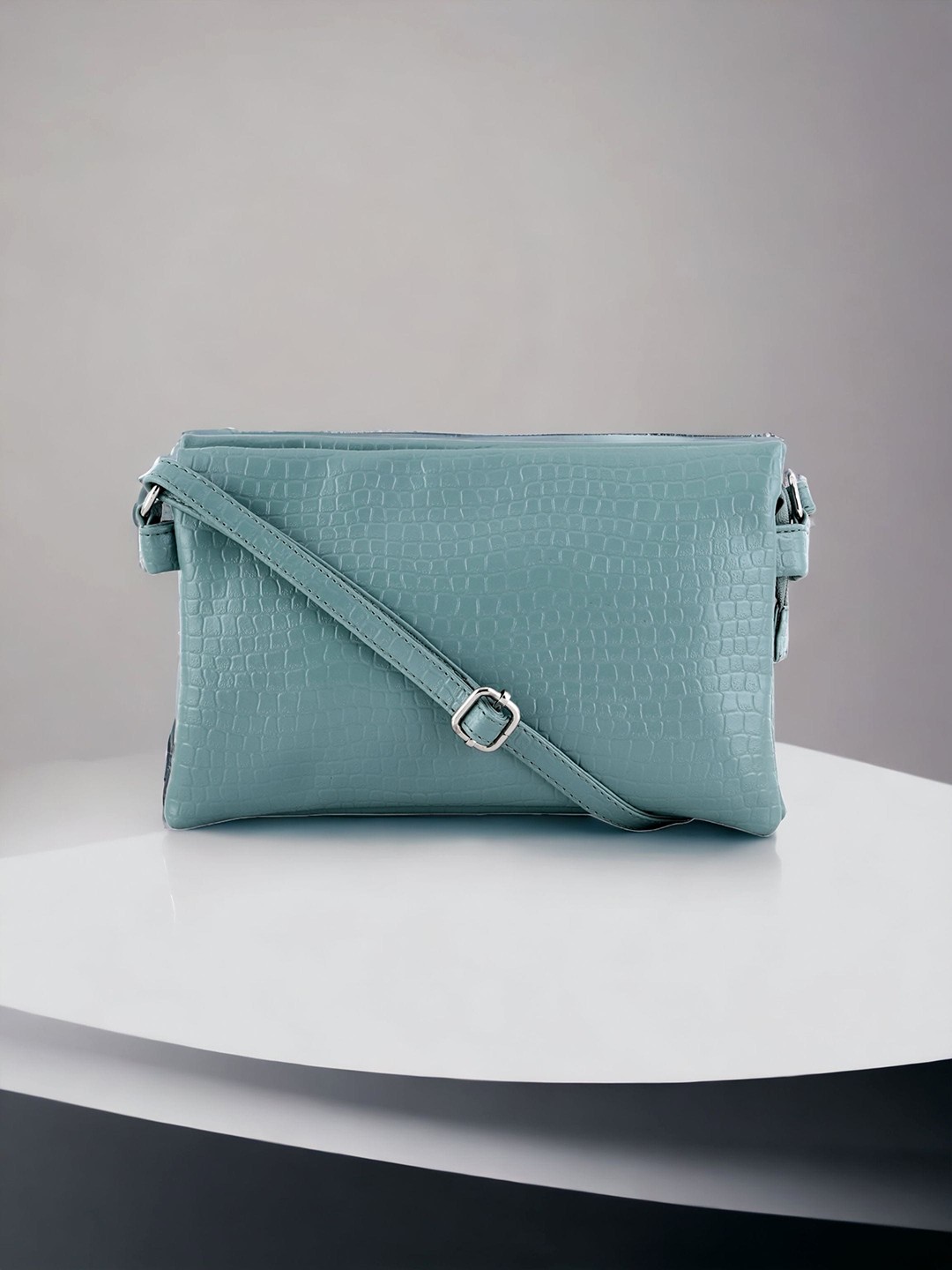 

Toteteca Textured Sling Bag, Sea green