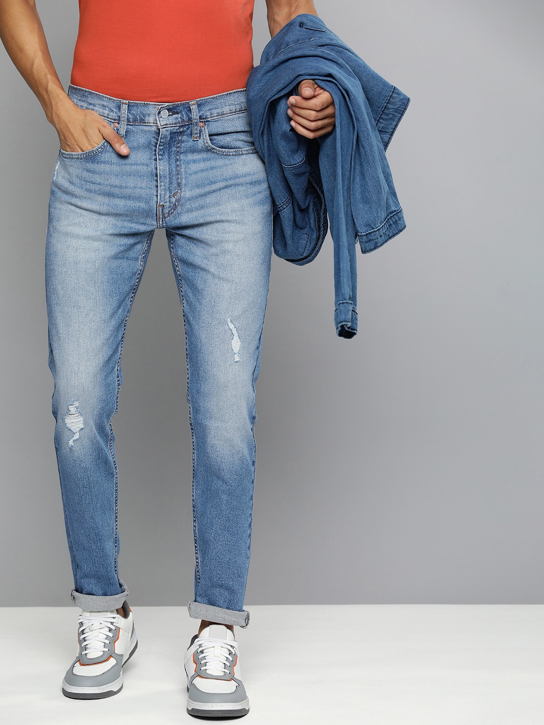 

Levis Men Tapered Fit Low Distress Light Fade Stretchable Jeans, Blue