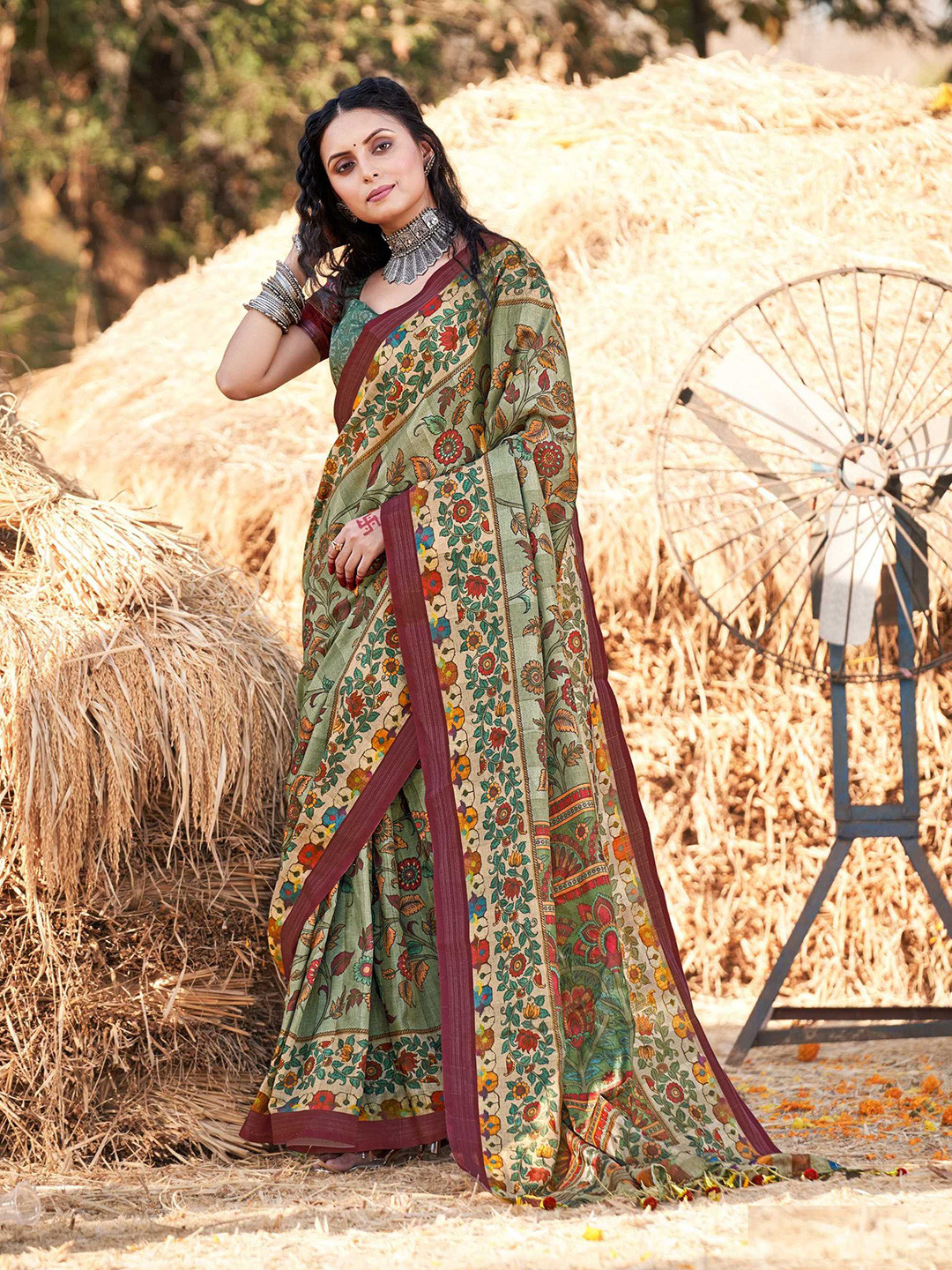 

Mitera Green & Magenta Kalamkari Zari Saree