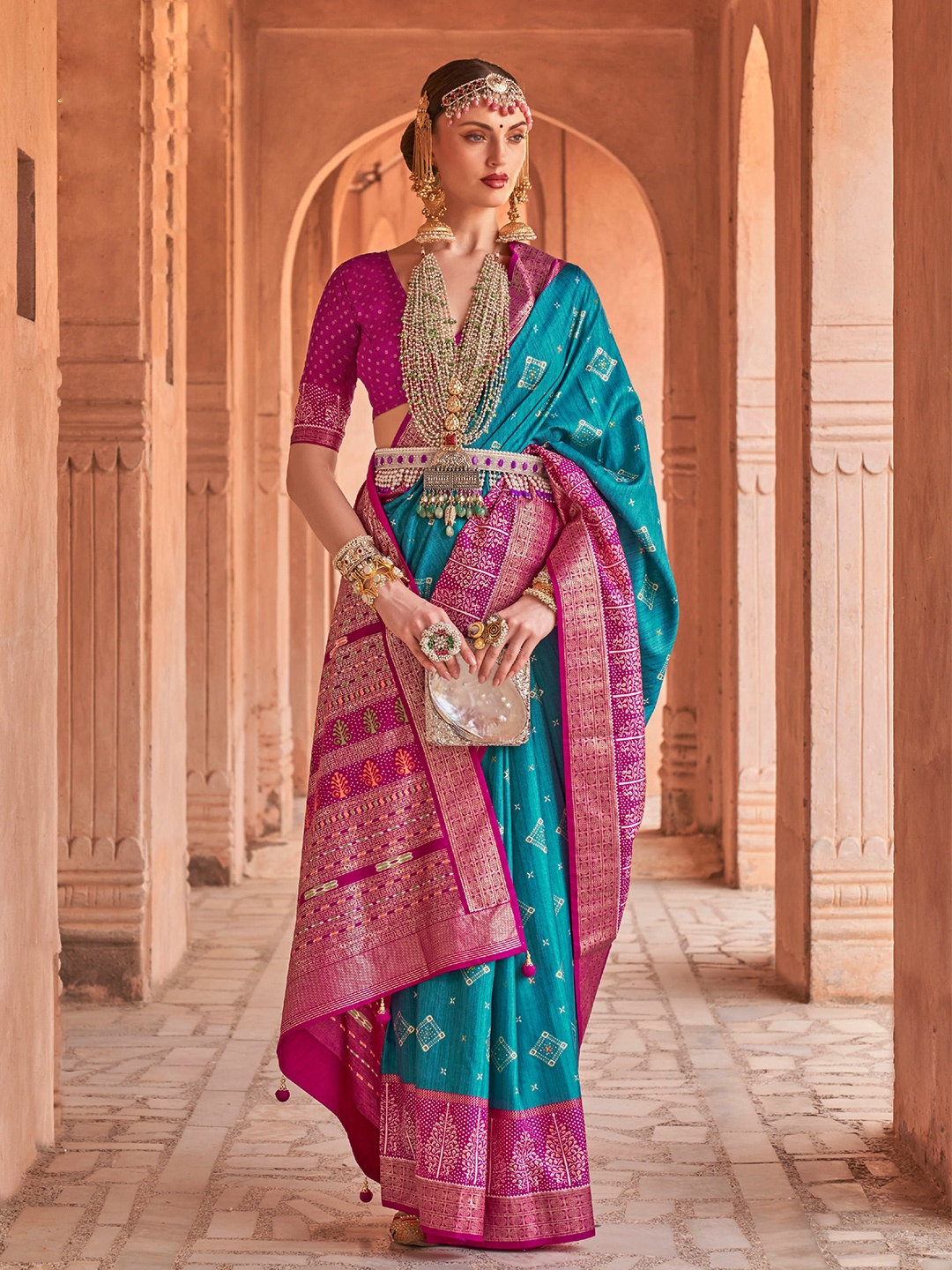 

Mitera Blue & Pink Ethnic Motifs Printed Silk Blend Patola Saree