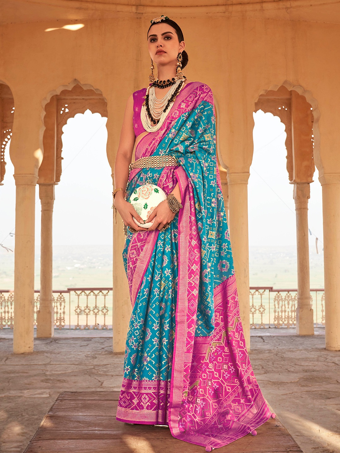 

Mitera Blue & Magenta Geometric Woven Design Zari Silk Blend Saree