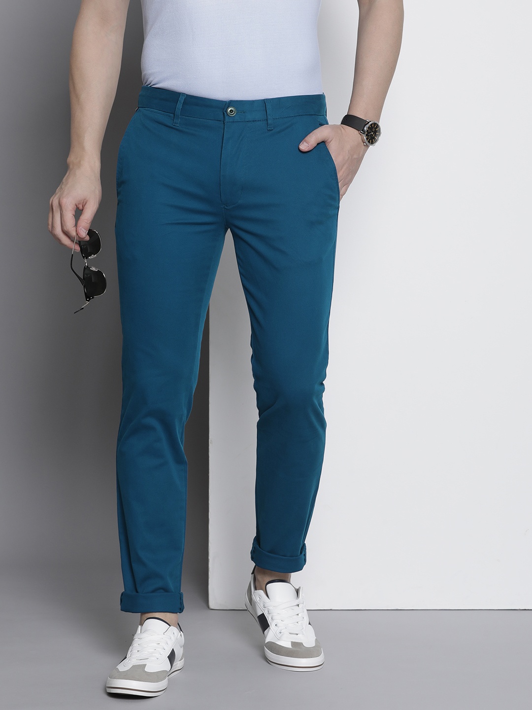 

Tommy Hilfiger Men Solid Slim Fit Mid-Rise Chinos Trousers, Blue