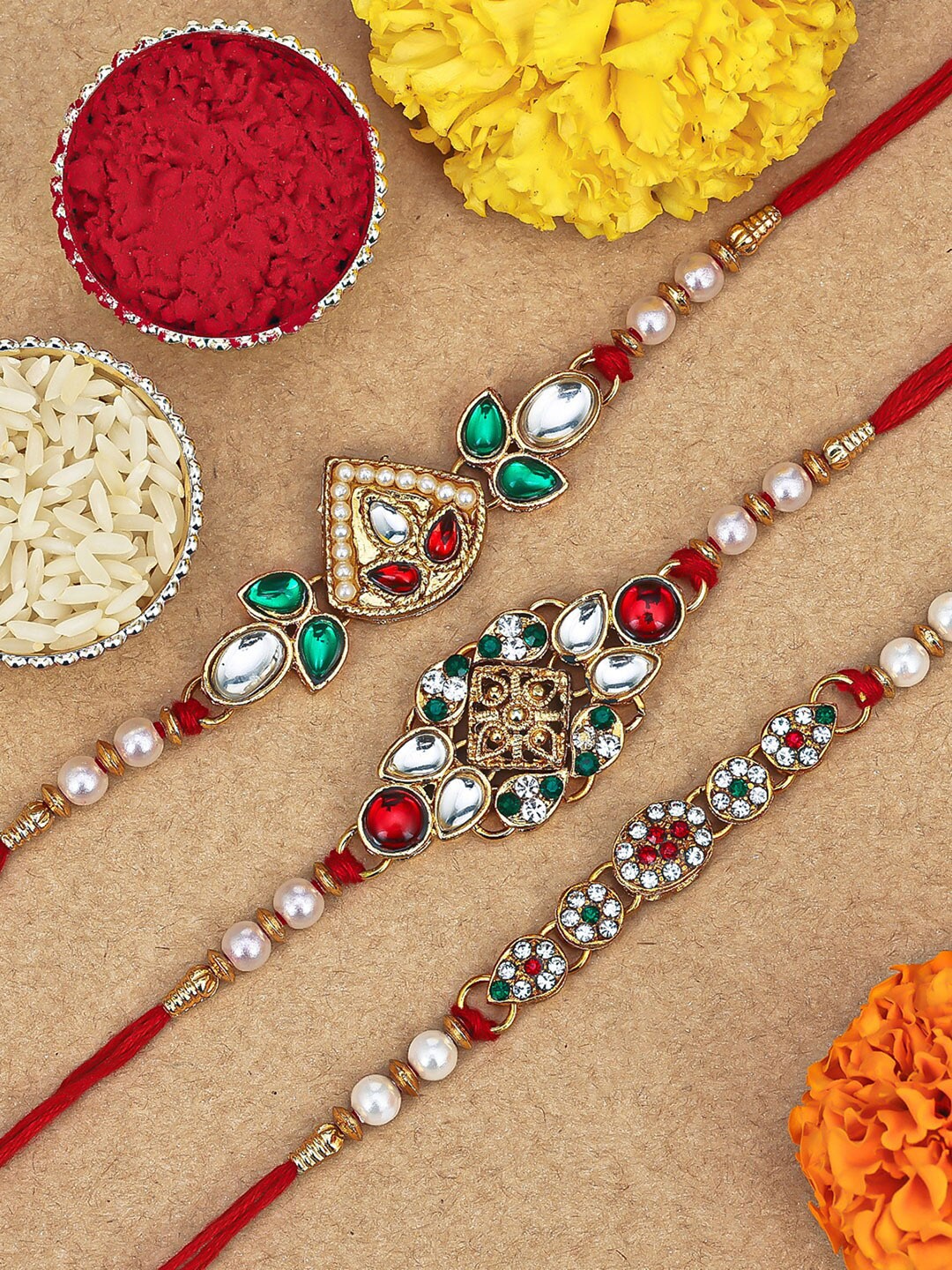 

Sukkhi Rakhi Set Of 3 Gold-Plated Stone Studded & Pearl Beaded Rakhi