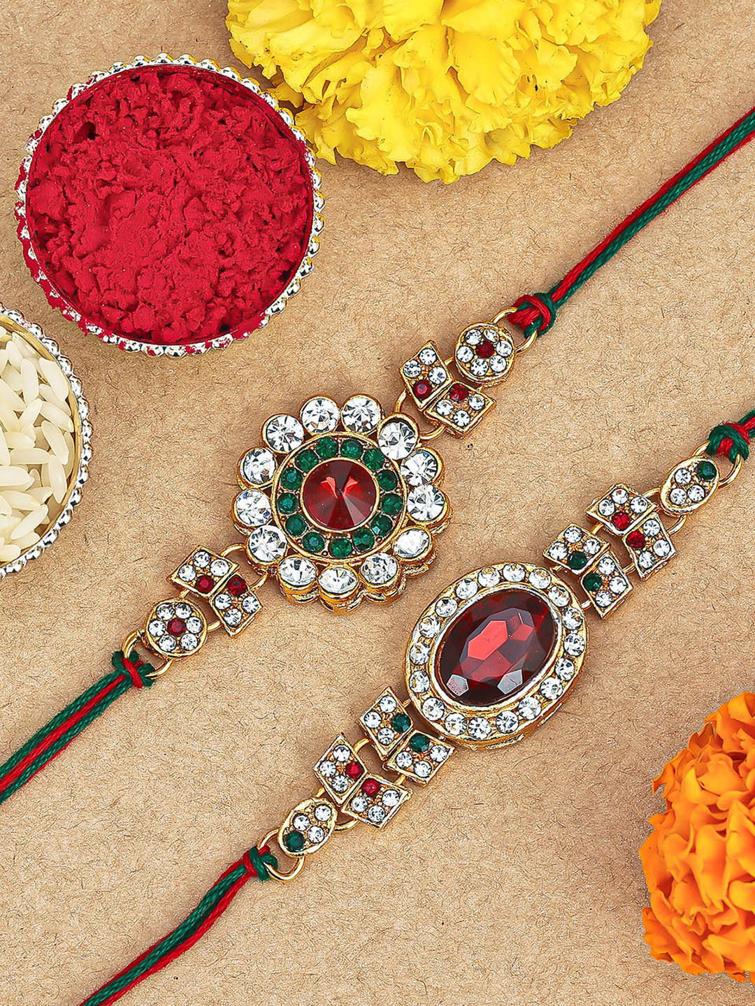 

Sukkhi Rakhi Set Of 2 Gold-Plated Stone-Studded Rakhi With Roli Chawal & Greeting Card