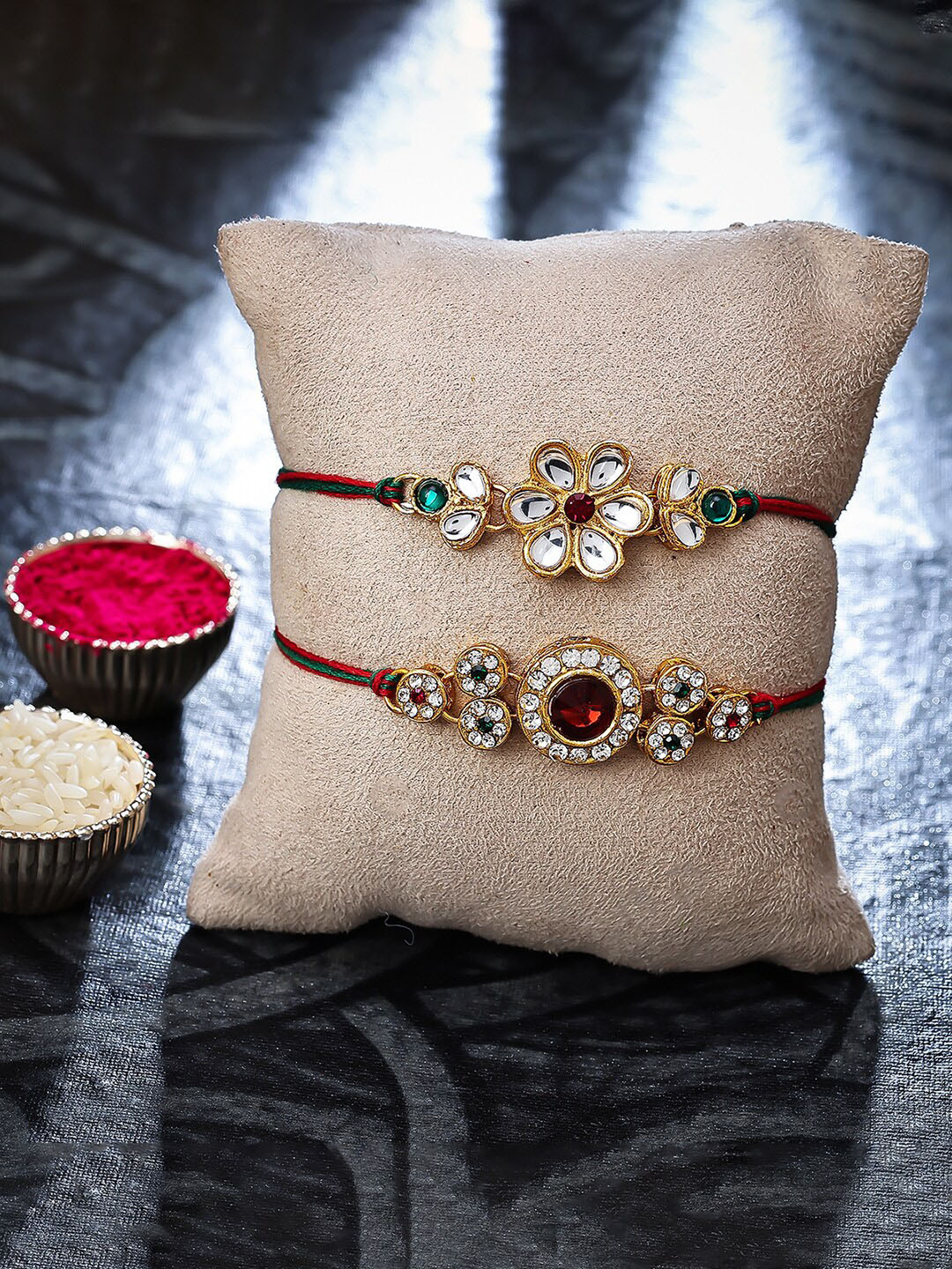 

Sukkhi Rakhi Set of 2 Gold-Plated Stone Studded Rakhi With Roli, Rice & Greeting Card