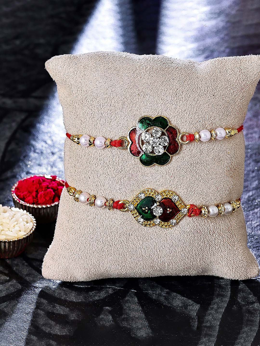 

Sukkhi Rakhi Set Of 2 Gold-Plated Rakhi With Roli, Rice & Greeting Card, Red