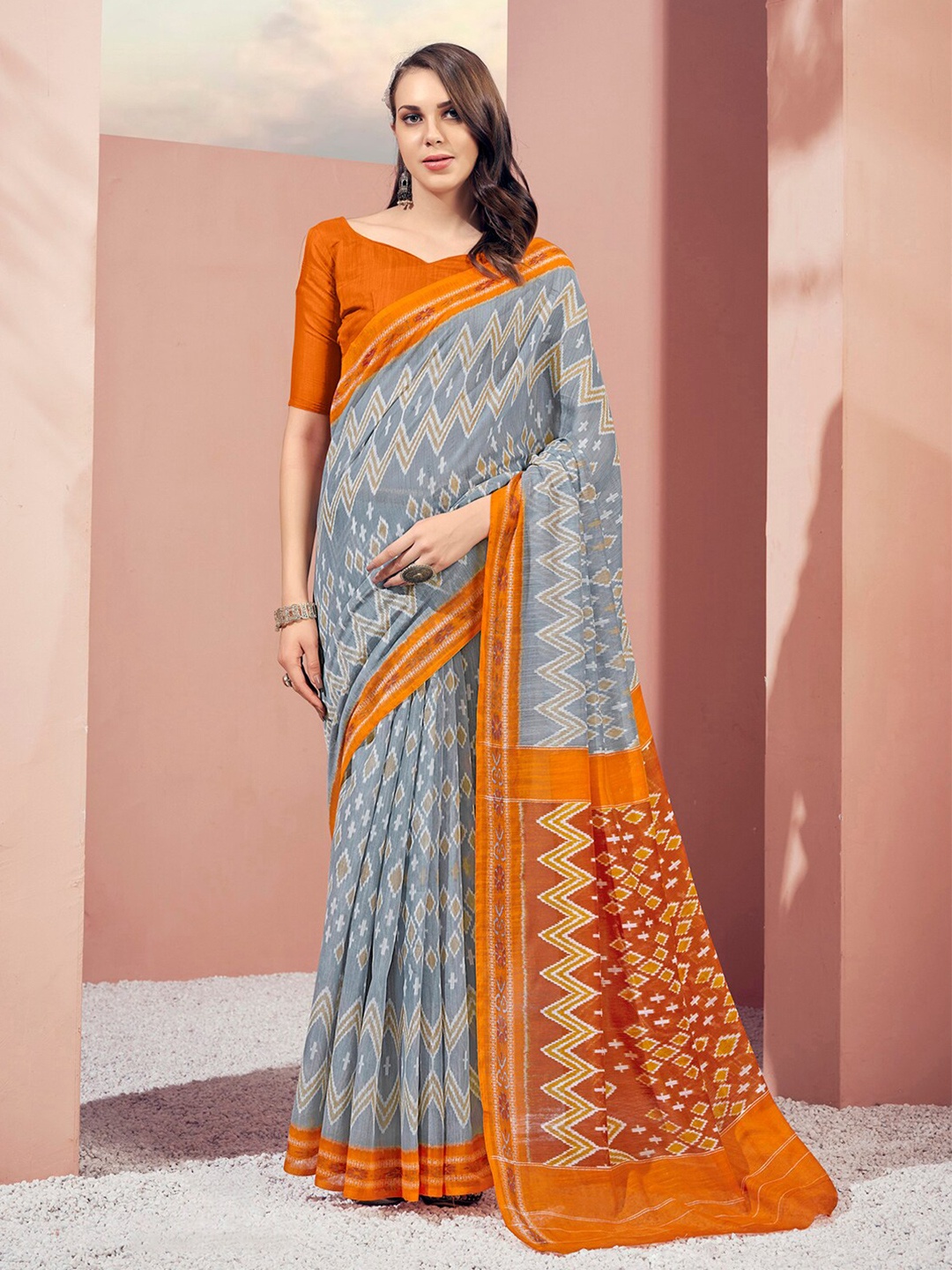 

Mitera Grey & Orange Ikat Print Polycotton Saree With Blouse Piece