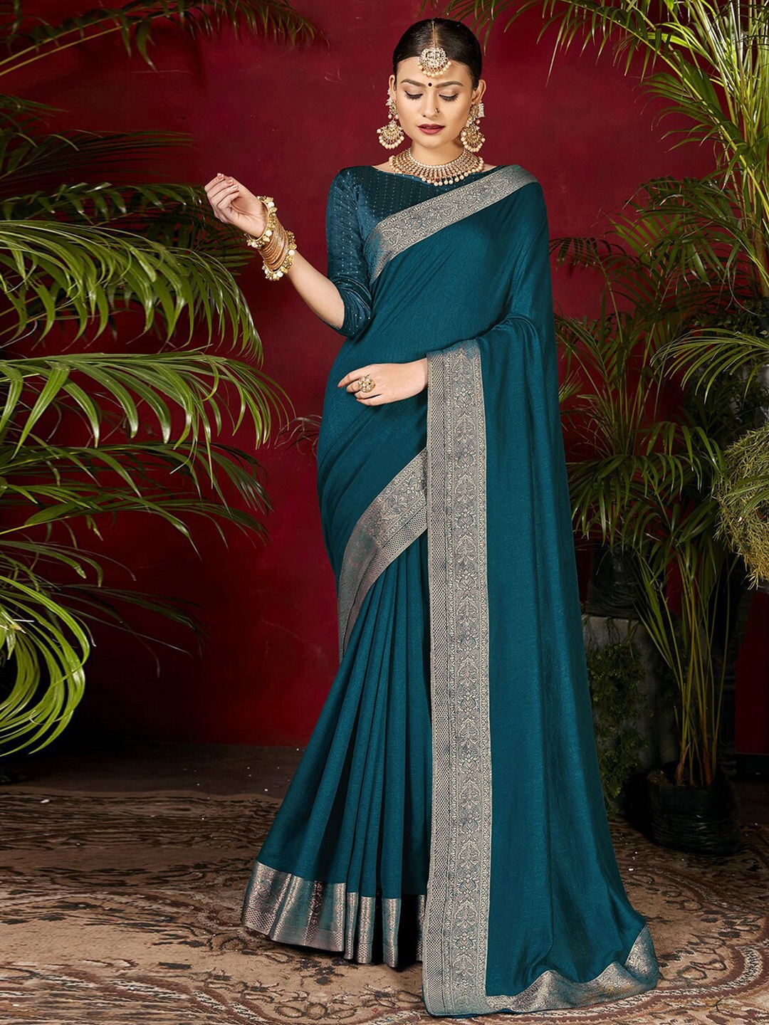 

Mitera Teal Blue Poly Silk Saree With Woven Zari Border