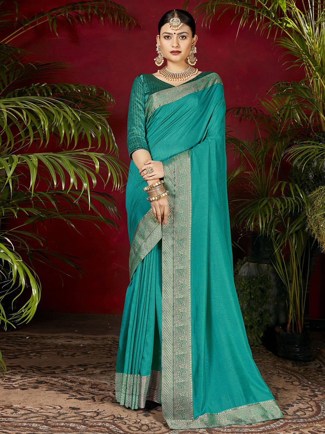 

Mitera Turquoise Blue & Gold-Toned Woven Design Zari Saree