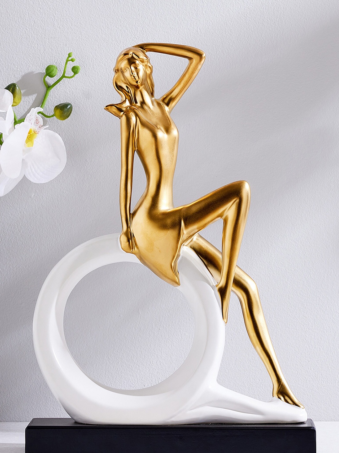 

Home Centre Gold-Toned Woman Ceramic Figurine Showpiece