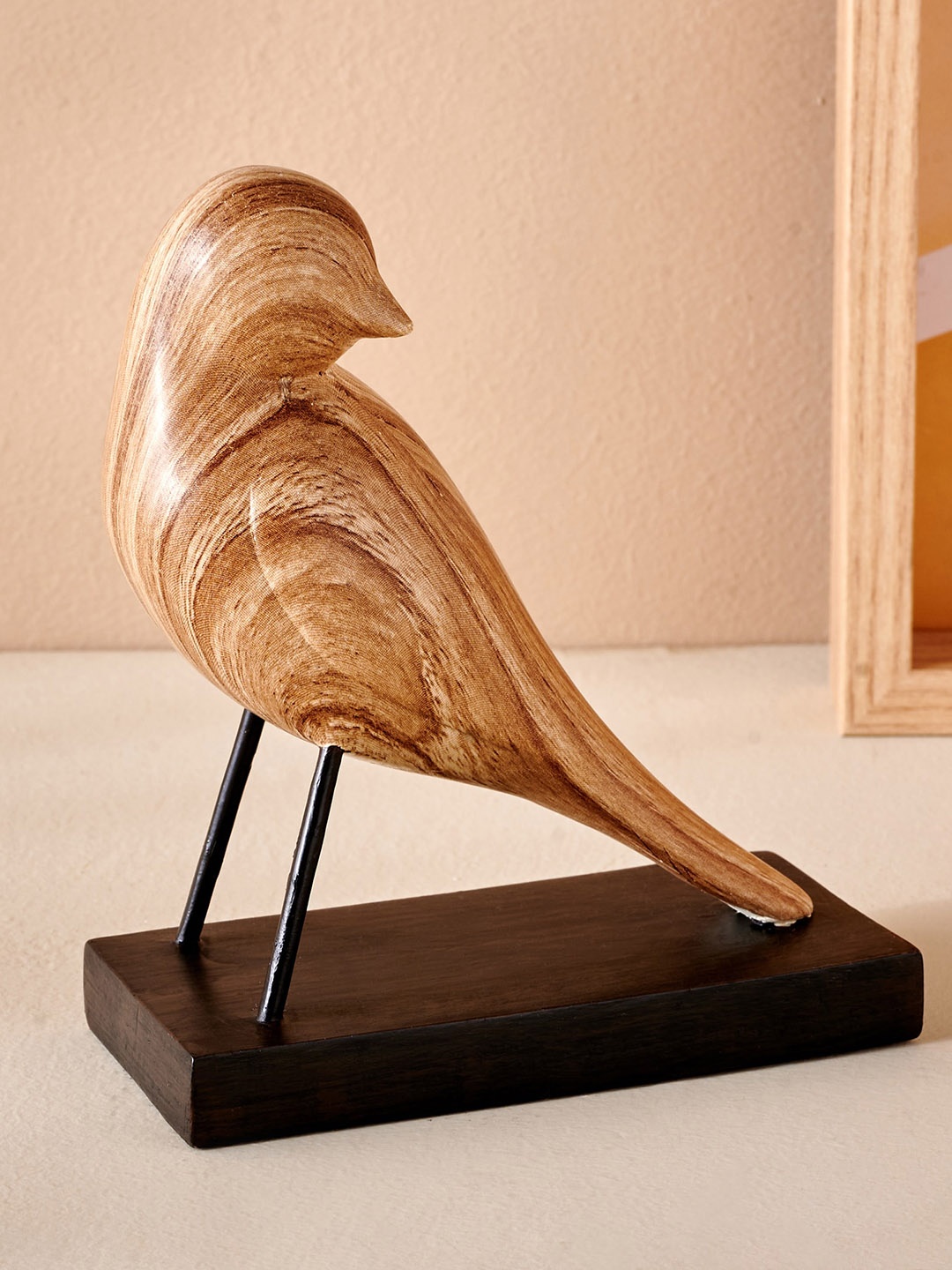 

Home Centre Brown Textured Sitting Bird Showpiece