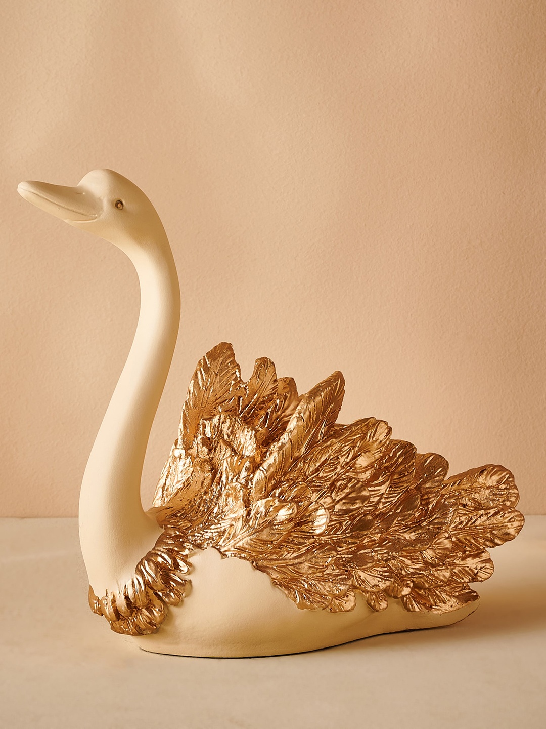 

Home Centre White & Beige Colored Textured Swan Figurine Showpiece