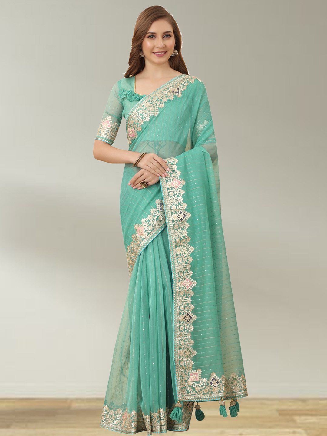 

N N ENTERPRISE Striped Embellished Sequinned Net Saree, Turquoise blue