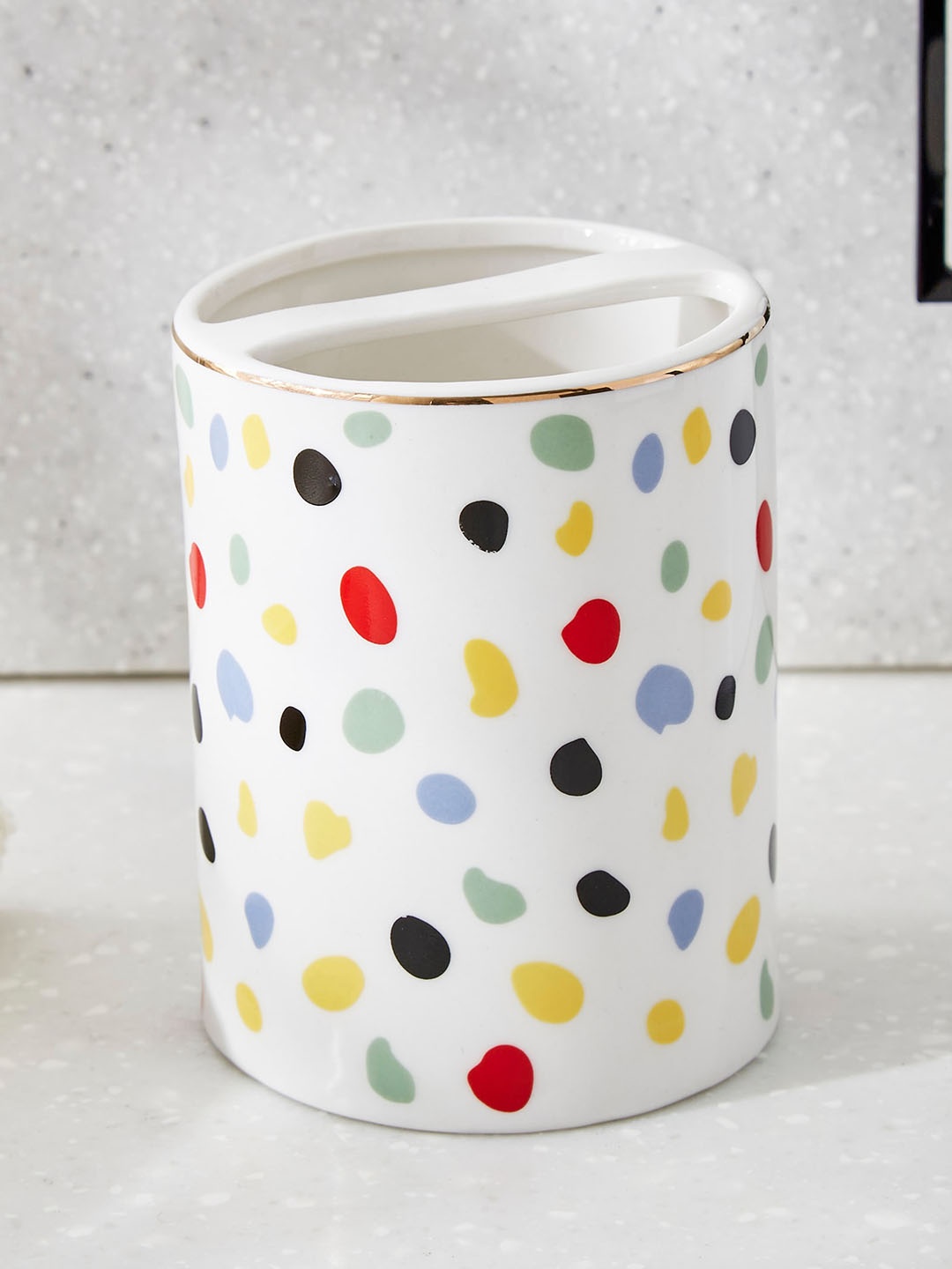 

Home Centre White & Yellow Printed Ceramic Toothbrush Holder