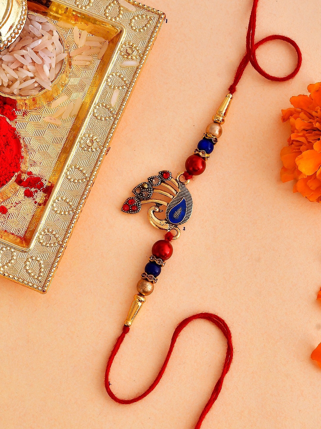 

Voylla Peacock Charm Thread Rakhi, Gold