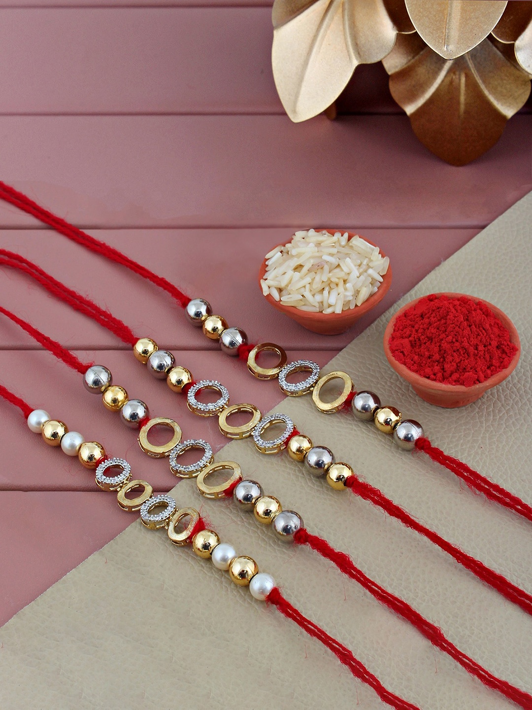 

LUCKY JEWELLERY Set of 4 Gold-Plated AD Studded Rakhis