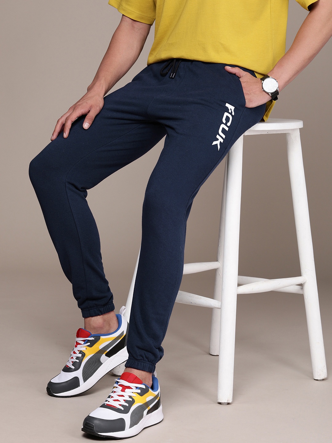 

FCUK Men Brand Logo Printed Mid-Rise Regular Joggers, Navy blue