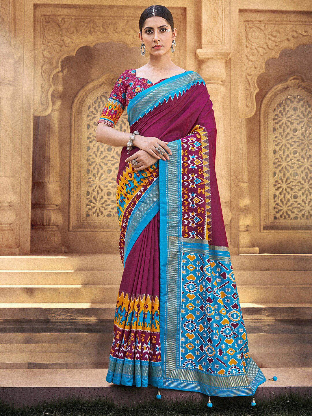 

Anouk Magenta & Turquoise Blue Ethnic Motifs Printed Zari Patola Saree