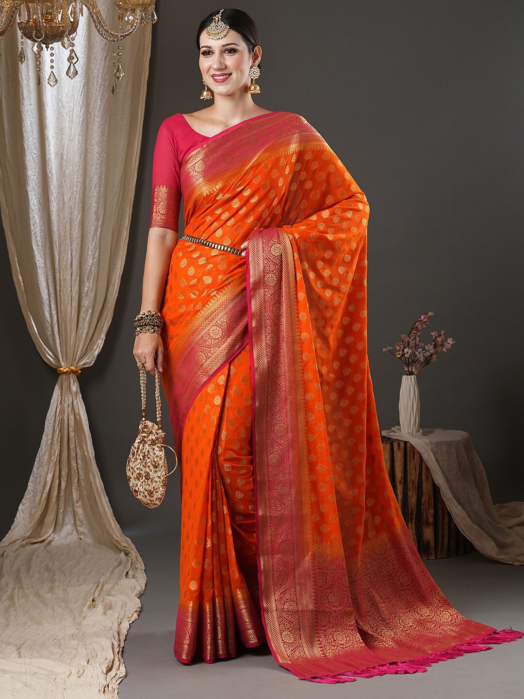 

Anouk Orange & Pink Ethnic Motifs Woven Design Zari Pure Georgette Kanjeevaram Saree