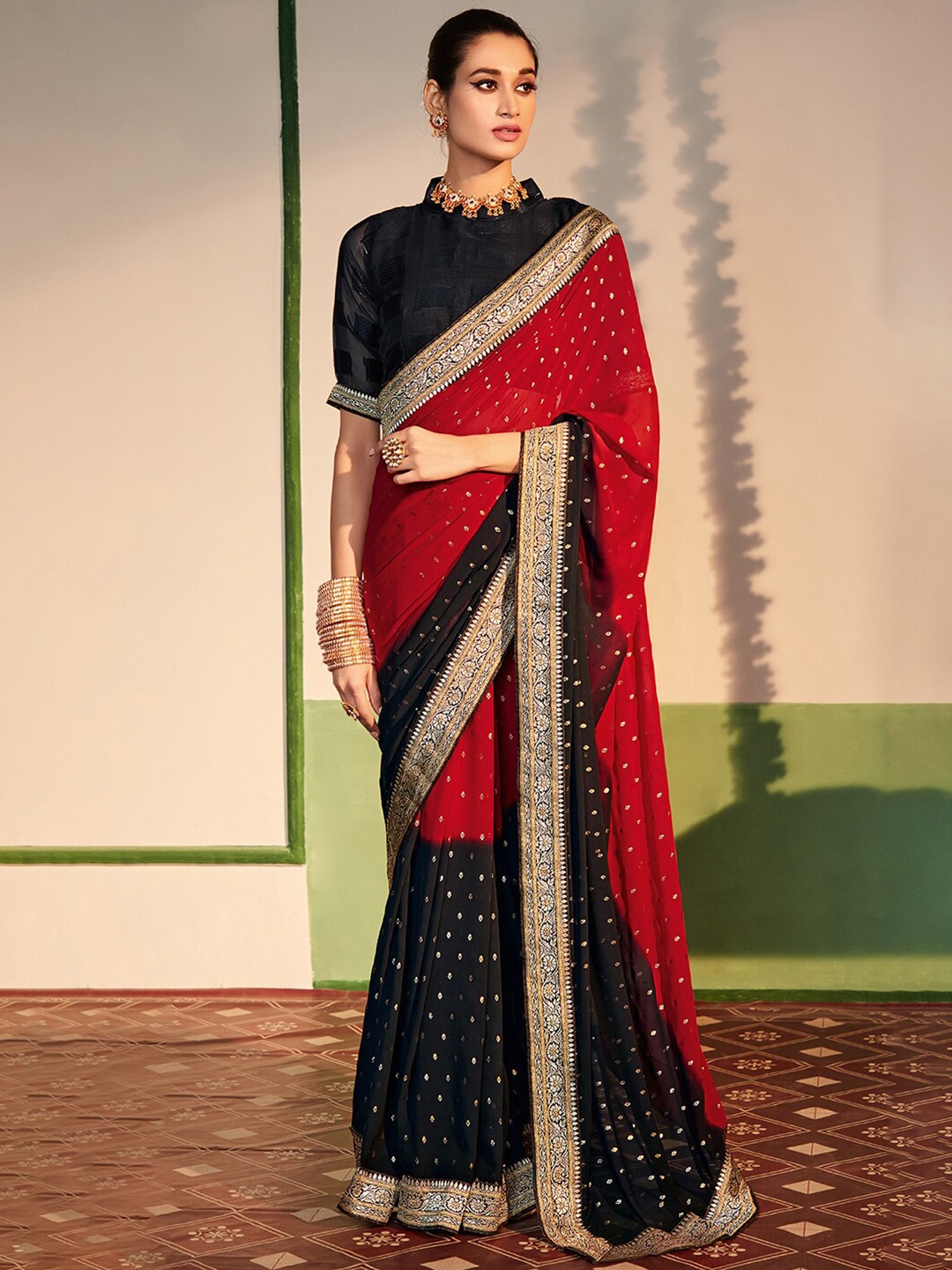 

Anouk Maroon & Black Ethnic Motifs Zari Pure Georgette Saree