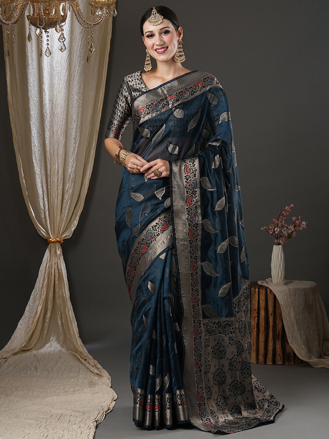 

Saree mall Teal Blue & Silver-Toned Woven Design Zari Organza Banarasi Sarees