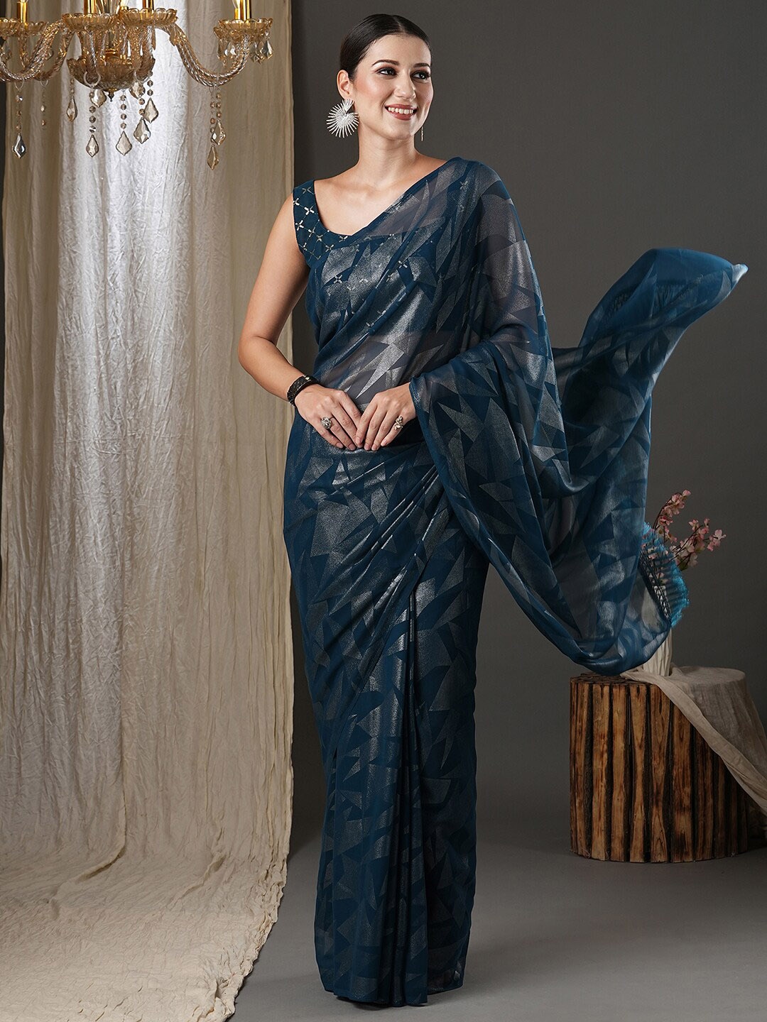 

Saree mall Teal Blue Geometric Printed Poly Georgette Saree