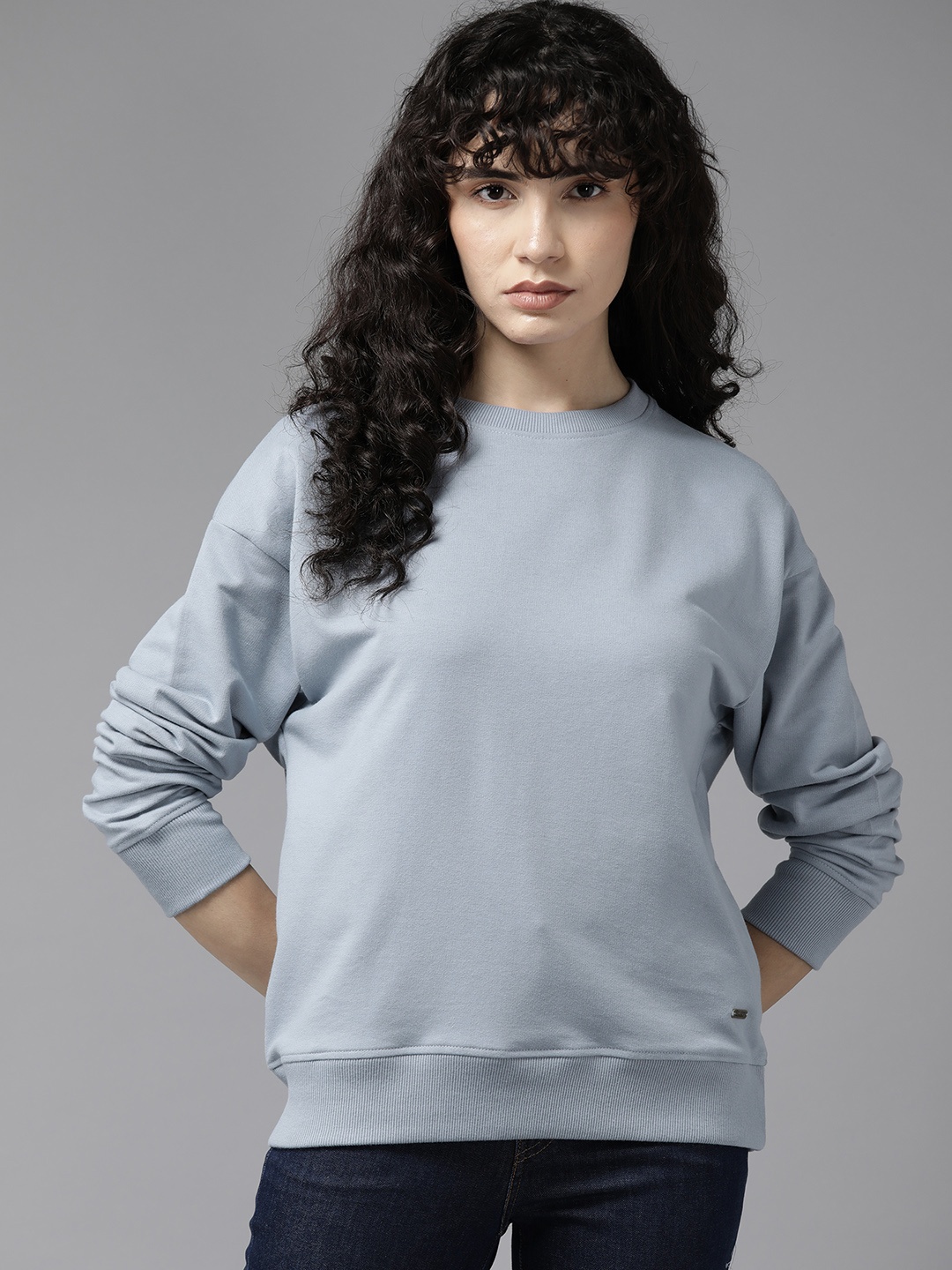 

Roadster Women Solid Pullover Sweatshirt, Blue