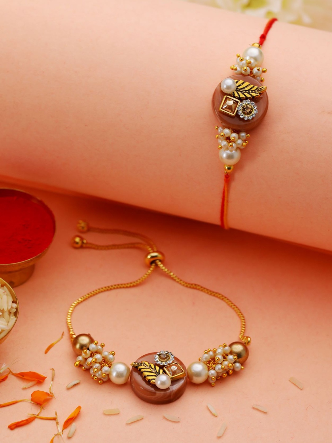 

Jazz and Sizzle Set Of 2 Stone & Pearls-Studded Rakhi With Roli & Chawal, Gold