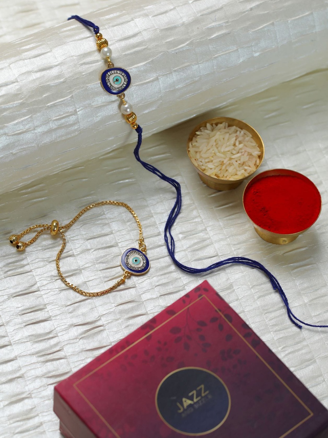 

Jazz and Sizzle Set Of 2 Evil Eye & Beaded Rakhis With Roli & Chawal, Blue