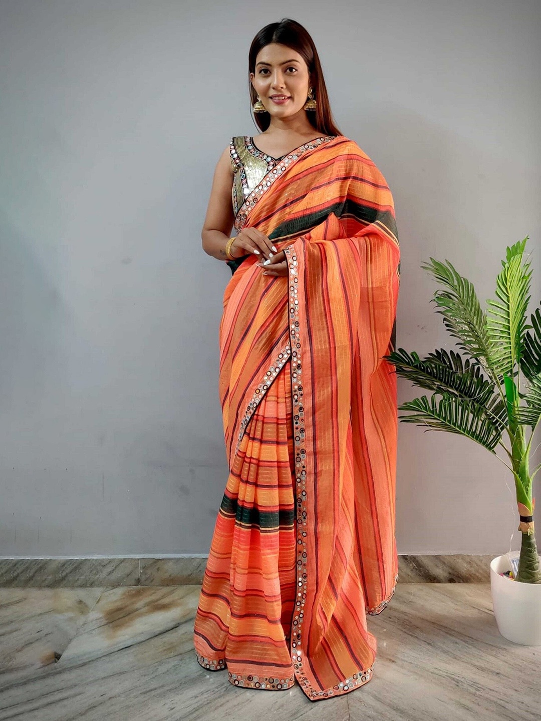 

Mitera Orange & Green Striped Mirror Work Saree