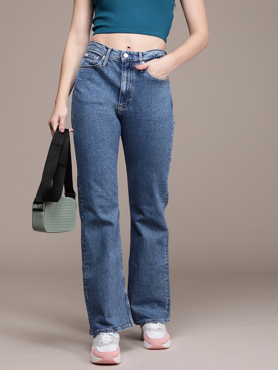 

Calvin Klein Jeans Women Bootcut Light Fade Stretchable Mid-Rise Jeans, Blue