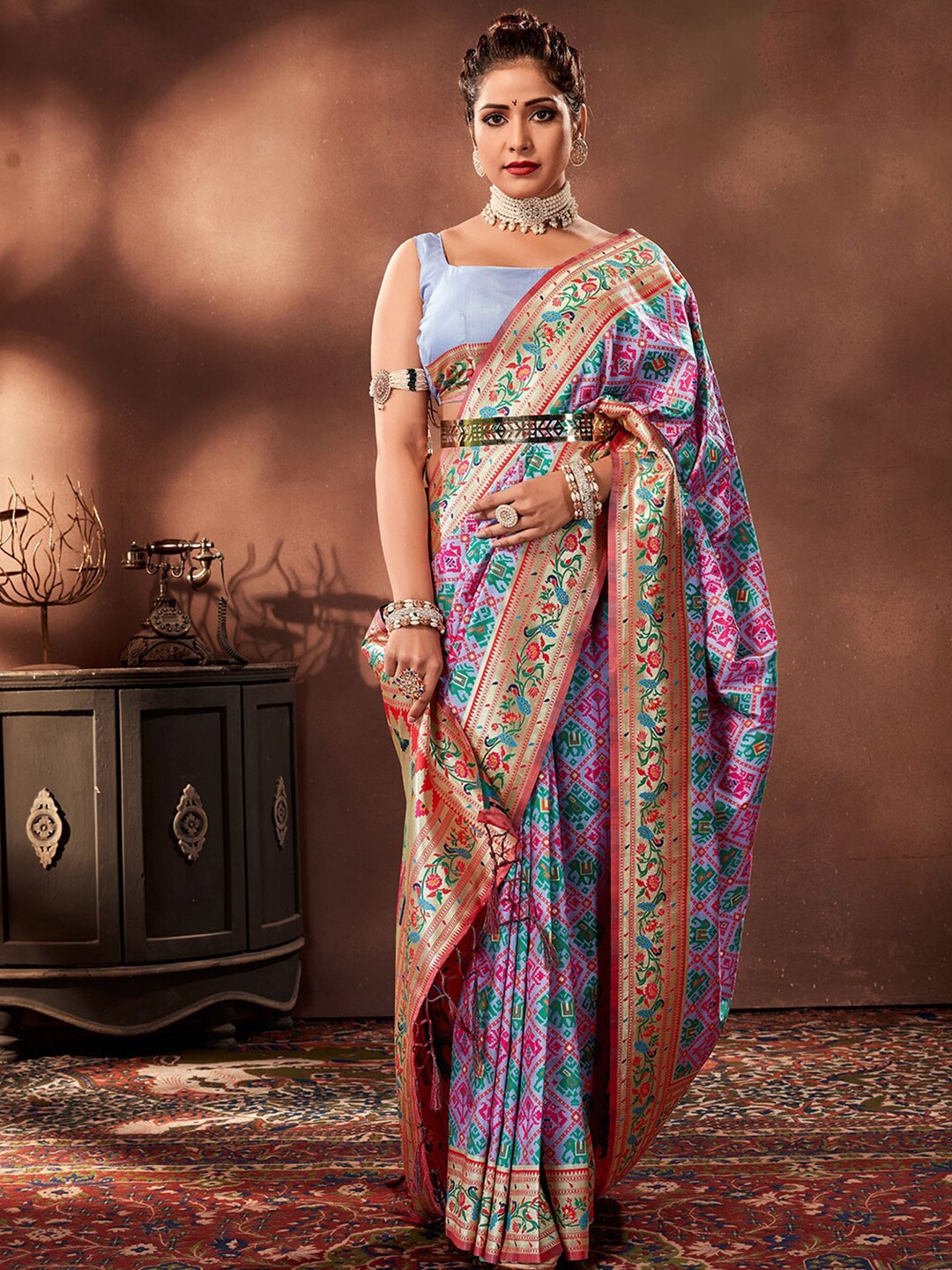 

Mitera Purple & Beige Woven Design Zari Art Silk Patola Saree