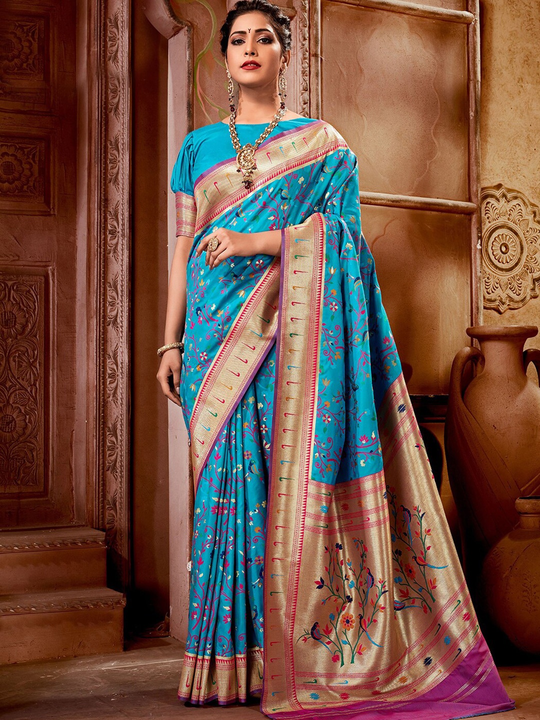 

Mitera Teal & Red Ethnic Motifs Woven Design Zari Paithani Saree