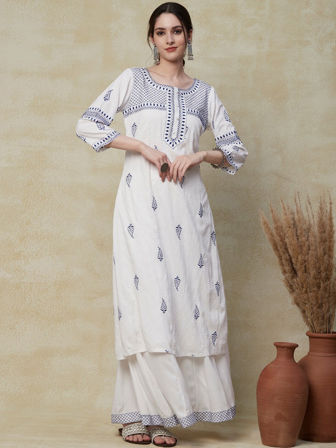 

FASHOR White Ethnic Motifs embroidered Regular Beads and Stones Kurta with Palazzos