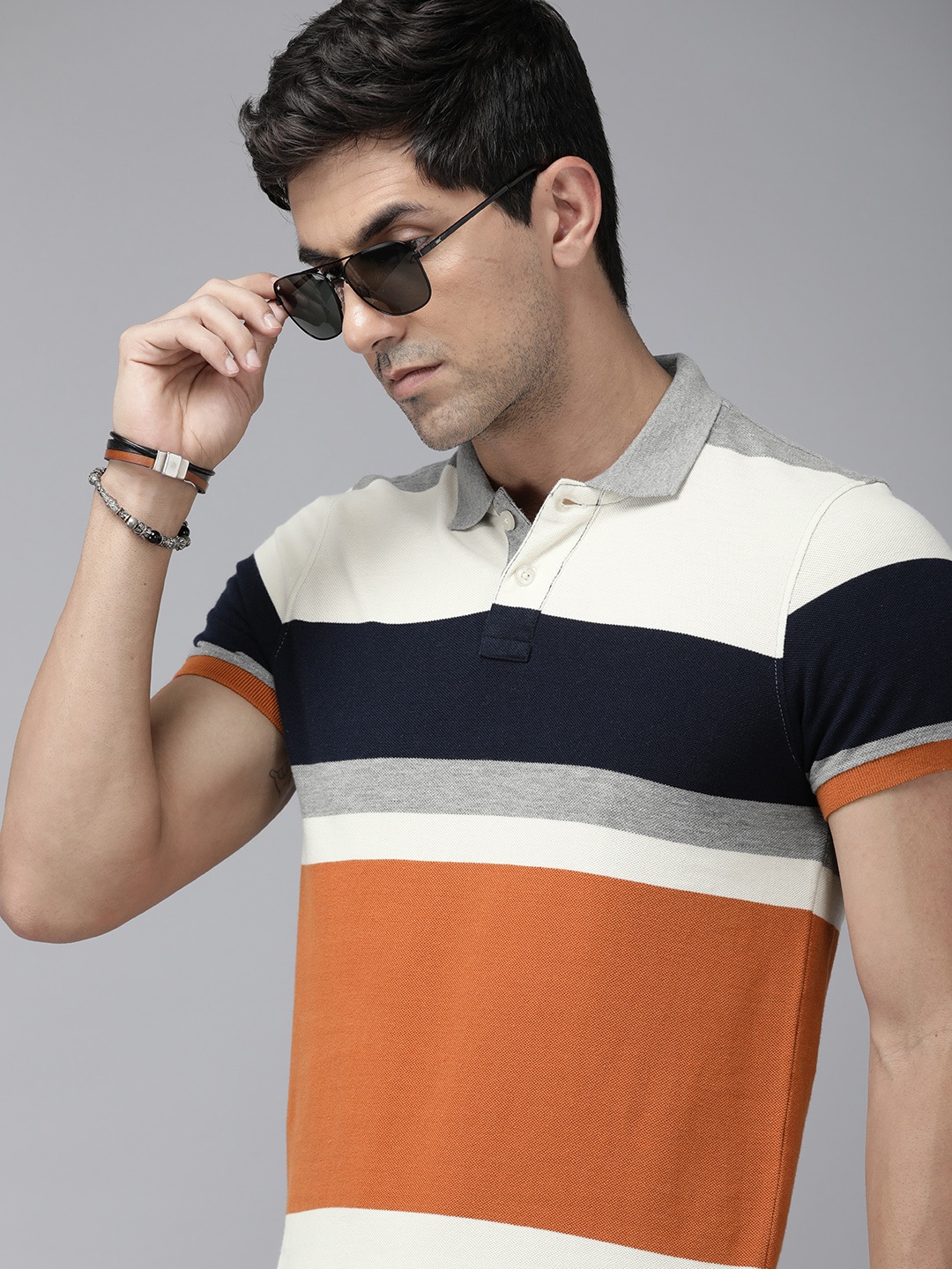 

Roadster Men Colourblocked Polo Collar T-shirt, Orange